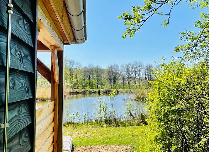 Comfortabele slaapkamer met sfeerverlichting in Vakantiehuisje in Zuidwolde, Zuidwest Drenthe