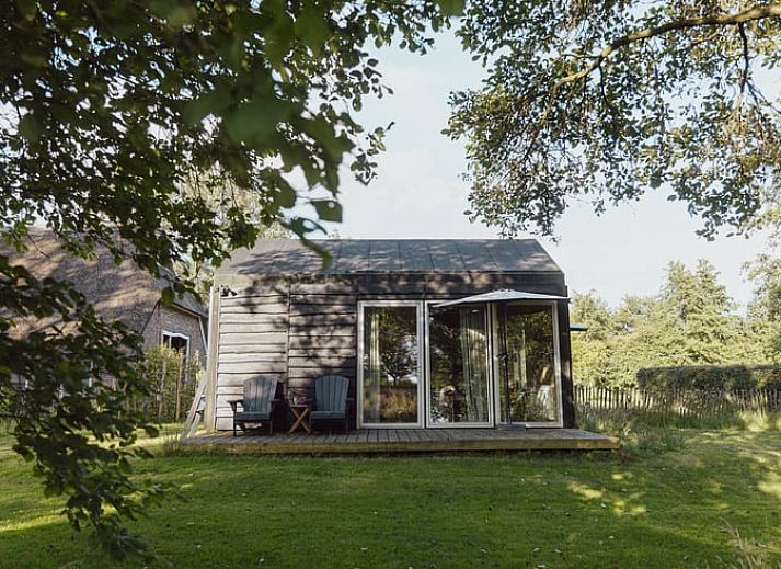 Gemuetliches Schlafzimmer in Huisje in Ruinen, Ferienhaus in Suedwest-Drenthe. Bequemes Bett und ruhige Atmosphaere fuer ultimative Entspannung.