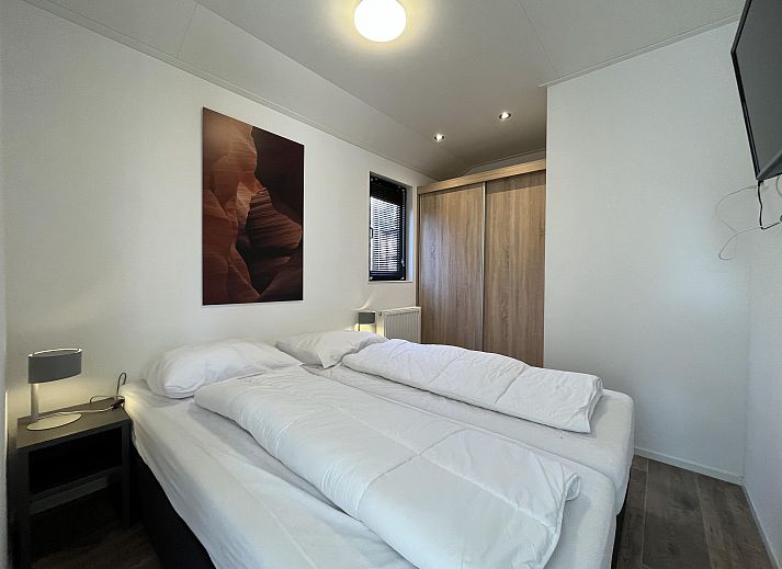 Detached house in Ruinen, Southwest Drenthe, vacation home with modern architecture and green garden by the water.