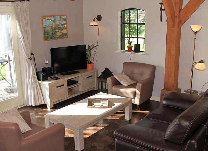 Charming vacation home DG591 in Dwingeloo, Drenthe, with wooden facade and rural feel.