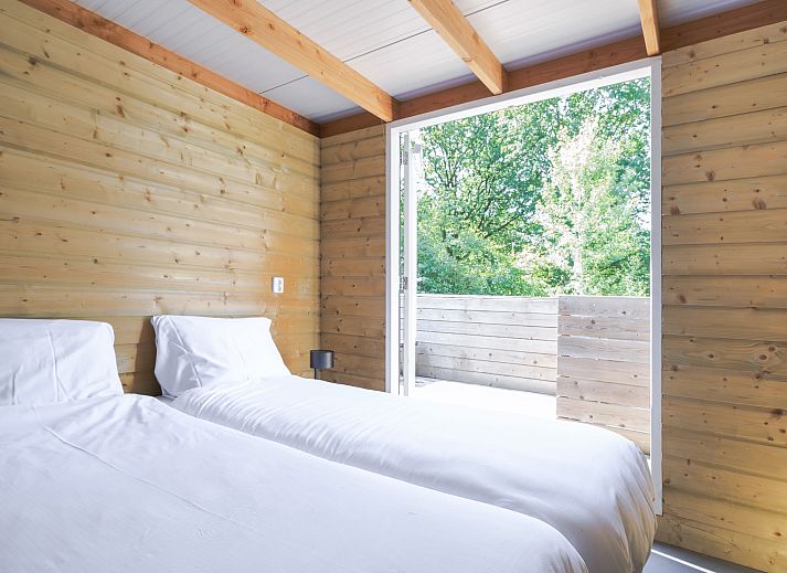 Enjoy the natural surroundings on the spacious terrace of Heidelodge, a vacation home in Dwingeloo, Southwest Drenthe.