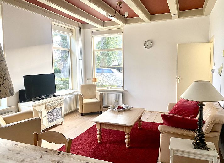 Geniet van de serene tuin en groene omgeving van vakantiehuis DG2051 in Ruinerwold, Zuidwest Drenthe, perfect voor natuurliefhebbers.