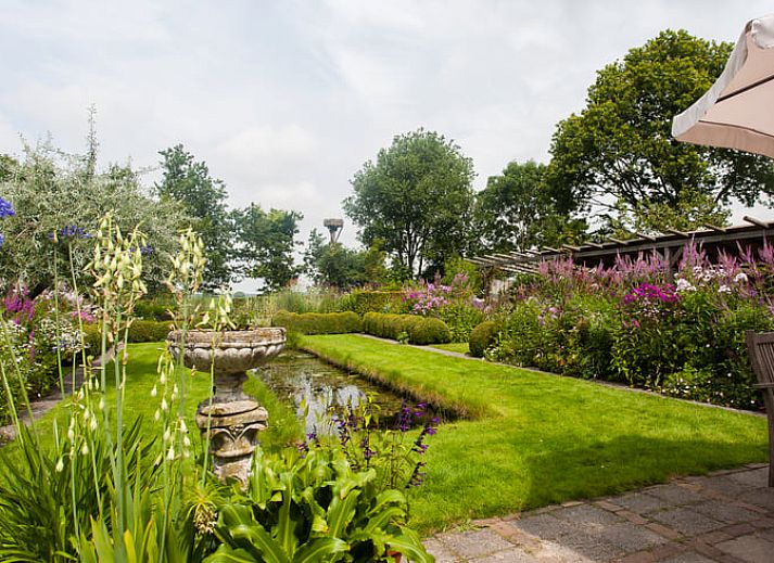 Geniessen Sie den Whirlpool im Ferienhaus in Ruinerwold, das in der ruhigen Landschaft von Suedwest-Drenthe liegt.