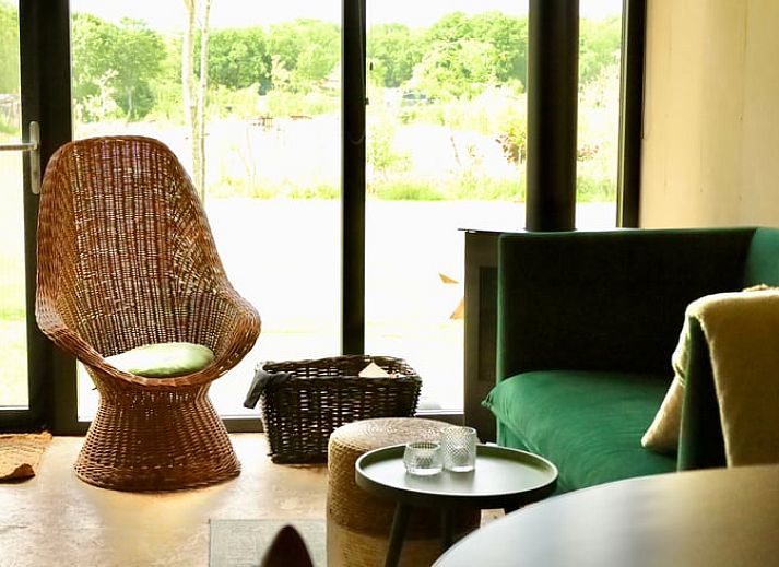 Cottage in Vledder at dusk, Southwest Drenthe, with atmospheric outdoor lighting.