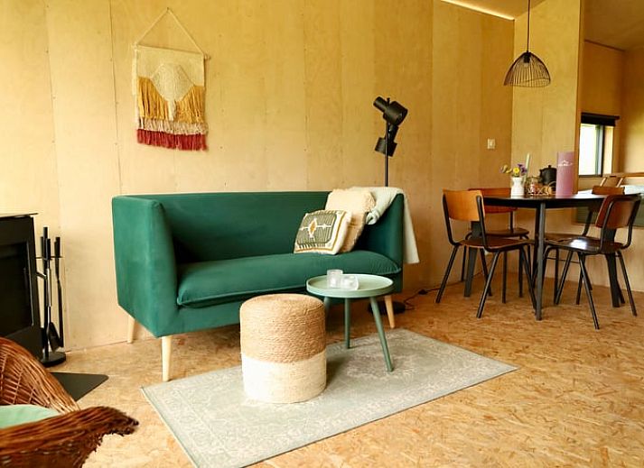 Cottage in Vledder at dusk, Southwest Drenthe, with atmospheric outdoor lighting.