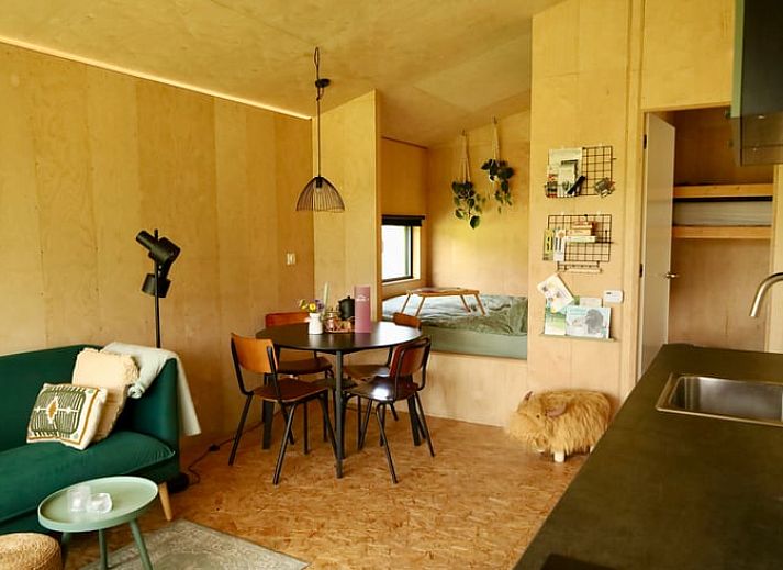 Cottage in Vledder at dusk, Southwest Drenthe, with atmospheric outdoor lighting.