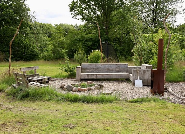 Dining and sleeping area in Holiday cottage in Vledder, Southwest Drenthe, with wooden interior.