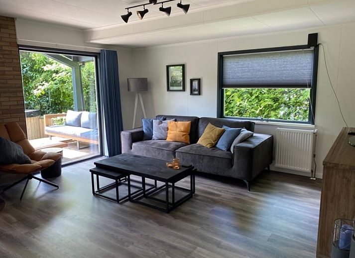 Charming bungalow Cottage 54 in Wateren, Drenthe, surrounded by green nature and an inviting terrace.