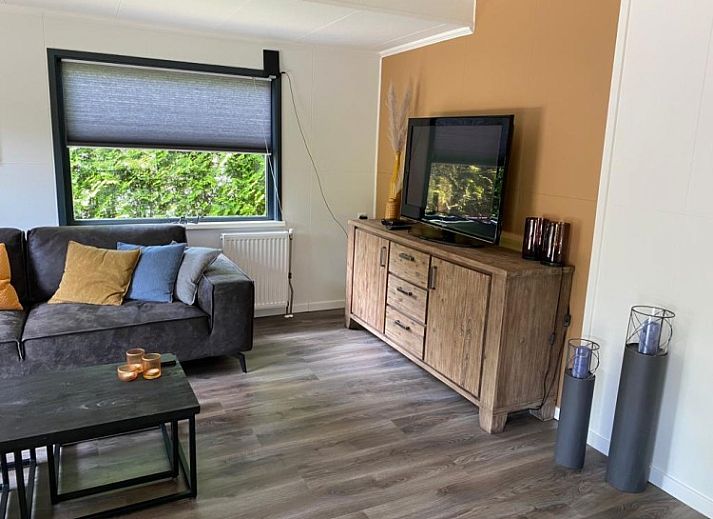 Charming bungalow Cottage 54 in Wateren, Drenthe, surrounded by green nature and an inviting terrace.