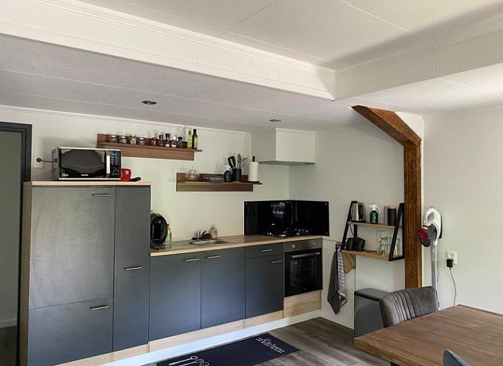 Cozy porch of Cottage 54 in Wateren, Southwest Drenthe, perfect for relaxing outdoor seating.