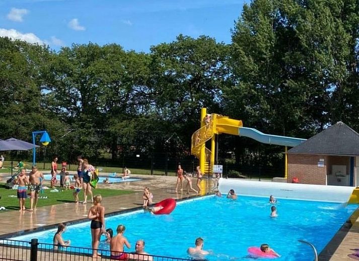 Stylish interior of Cottage 54 in Wateren, Drenthe, with a cozy sitting area and flat-screen TV.