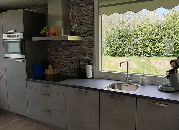 Atmospherically lit patio in Holiday Home in Wittelte, Southwest Drenthe, for evening meals outside.