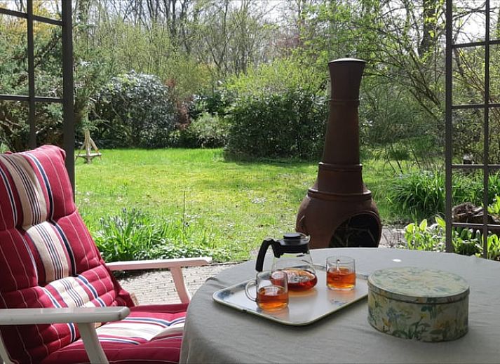 Sunrise at Cottage in Koekange, cottage in Southwest Drenthe, overlooking misty fields and trees.