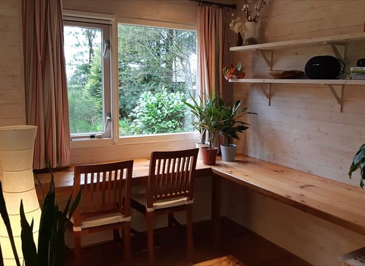 Front view of Cottage in Koekange, vacation home in Southwest Drenthe, surrounded by lush green garden.