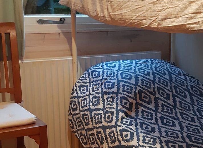 Cozy porch of Huisje in Koekange, cottage in Southwest Drenthe, with tea and garden views.