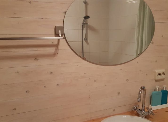 Cozy porch of Huisje in Koekange, cottage in Southwest Drenthe, with tea and garden views.