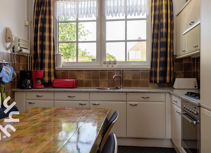 Gemuetliches Wohnzimmer im Ferienhaus DG407, Uffelte, Suedwest-Drenthe, mit komfortabler Sitzecke.