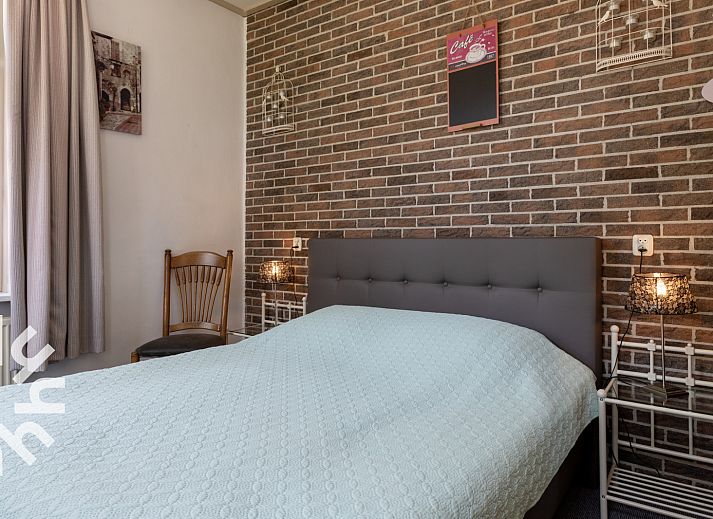 Gemuetliches Wohnzimmer im Ferienhaus DG407, Uffelte, Suedwest-Drenthe, mit komfortabler Sitzecke.