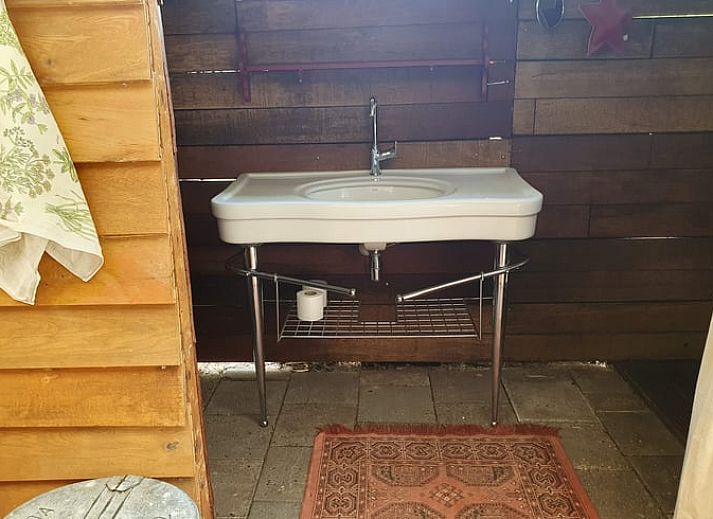 Uitzicht op groene velden vanuit de tuin van Vakantiehuisje in Elim, Zuidwest Drenthe.