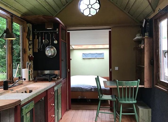 Cozy indoor area of Huisje in Veenhuizen overlooking nature in Frederiksoord, Drenthe.