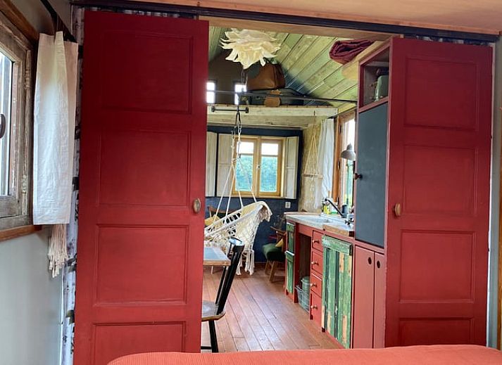 Cozy indoor area of Huisje in Veenhuizen overlooking nature in Frederiksoord, Drenthe.