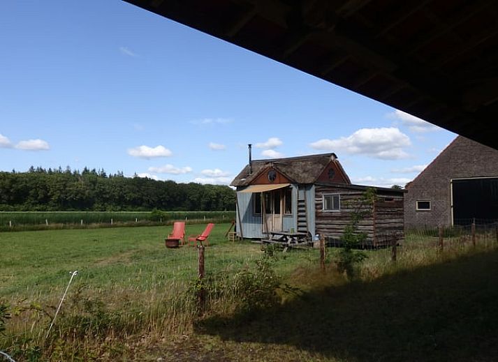 Cozy indoor area of Huisje in Veenhuizen overlooking nature in Frederiksoord, Drenthe.