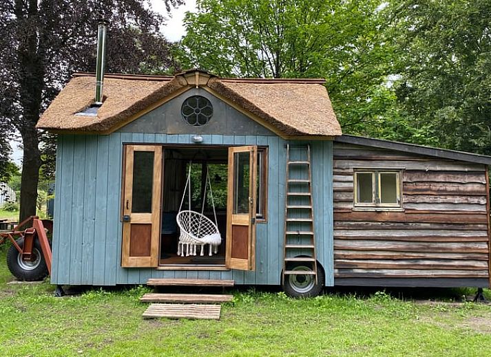 Cozy corner with wood stove in Cottage in Veenhuizen, ideal for relaxation in Frederiksoord, Southwest Drenthe.