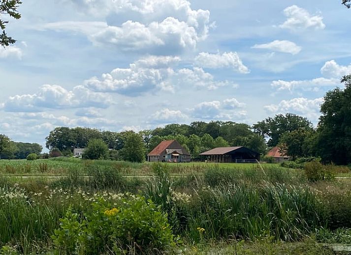 Cozy corner with wood stove in Cottage in Veenhuizen, ideal for relaxation in Frederiksoord, Southwest Drenthe.