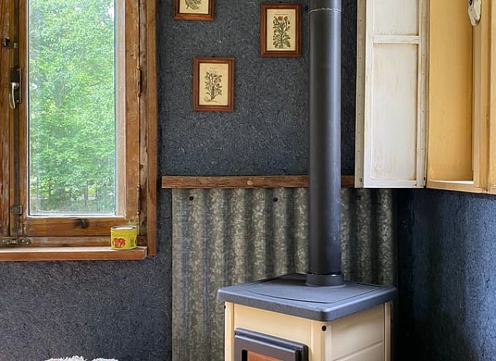 Cozy corner with wood stove in Cottage in Veenhuizen, ideal for relaxation in Frederiksoord, Southwest Drenthe.
