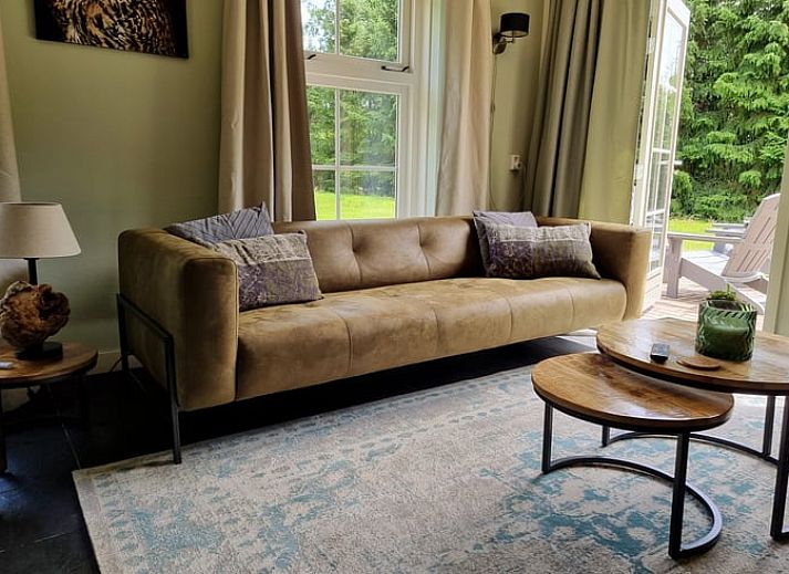 Ferienhaus in Oude Willem, umgeben von Baeumen im ruhigen Suedwesten von Drenthe, ideal fuer einen erholsamen Aufenthalt.