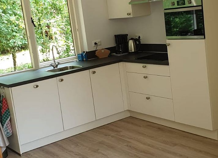 Covered sitting area at Holiday Home in Oude Willem, ideal for relaxation in Drenthe.