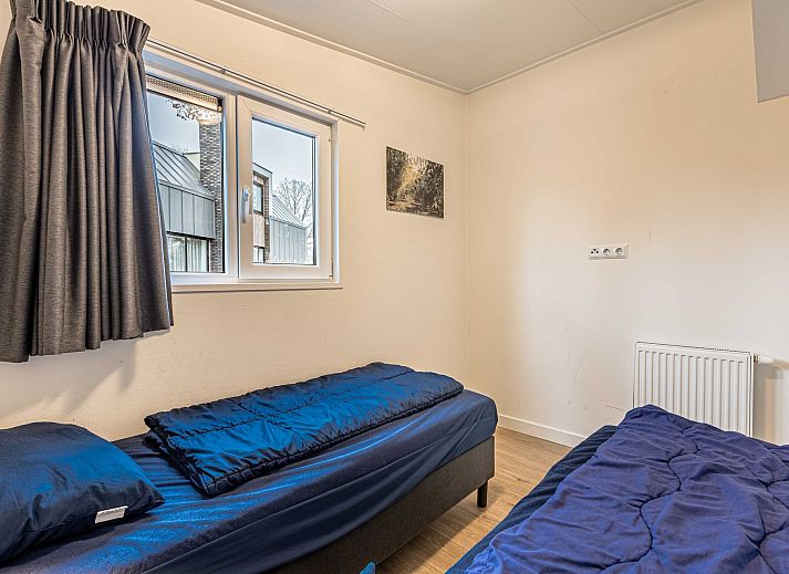 Veranda des freistehenden Hauses in Biddinghuizen mit Blick auf den grnen Garten in Ost-Flevoland, ideales Ferienhaus fr Naturliebhaber.