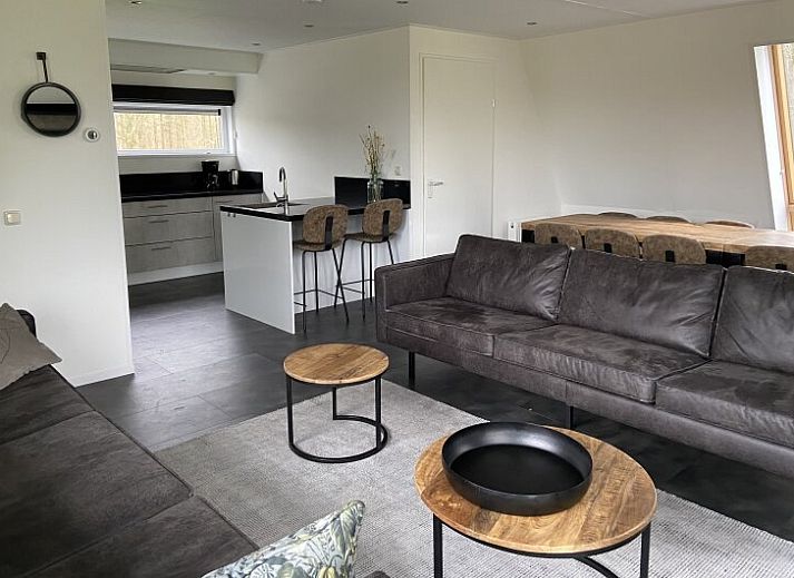 Modern detached house in Biddinghuizen, Flevoland, with spacious terrace and green surroundings, ideal vacation home for nature lovers.