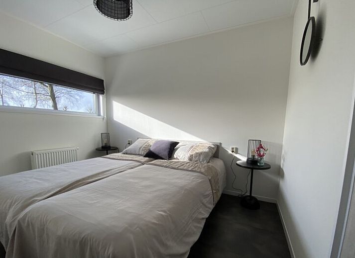 Spacious living room of detached house in Biddinghuizen, Eastern Flevoland, with modern furnishings and comfortable seating area.