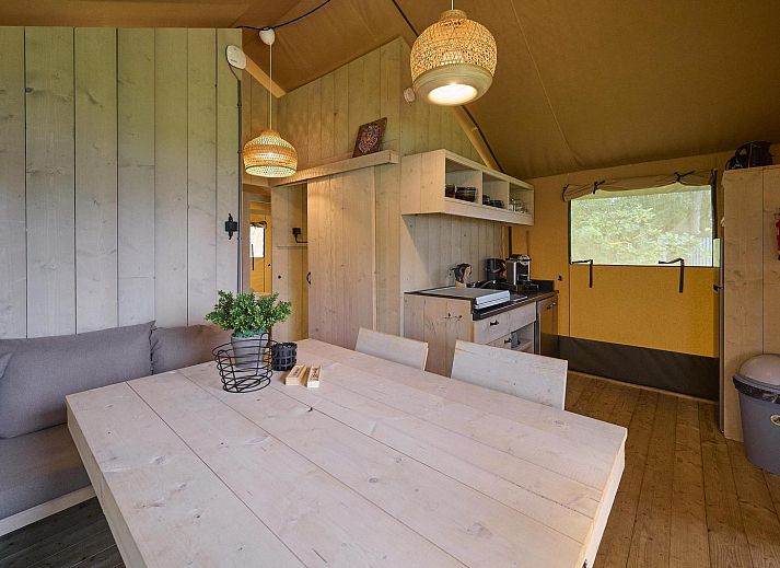 Safari tent Wood in Biddinghuizen with spacious veranda and green surroundings, ideal for 4-6 people in Flevoland.