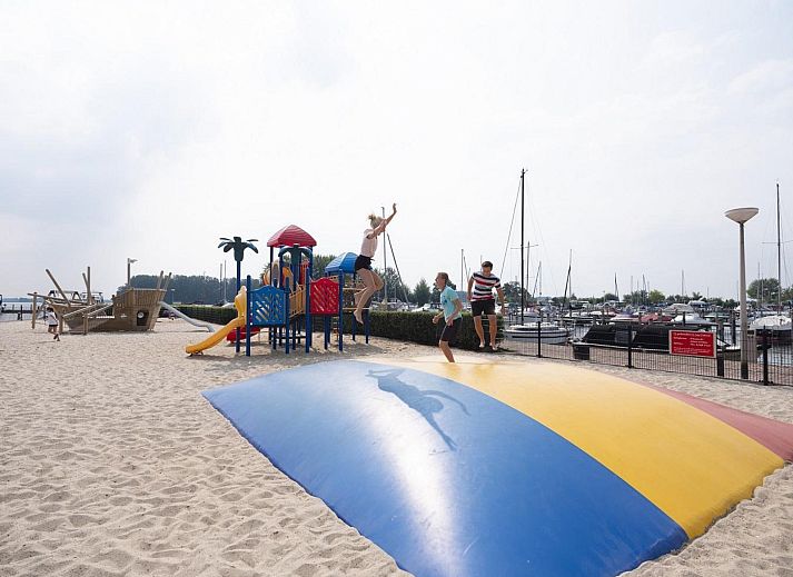 Comfortable interior of Safari Tent Wood in Biddinghuizen with sitting area and plenty of natural light in Flevoland.