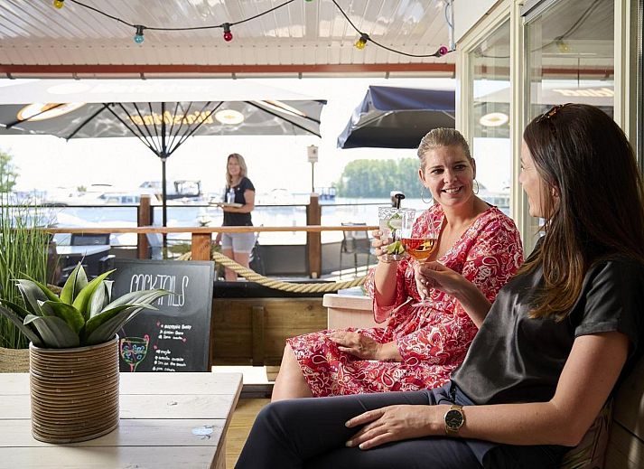 Comfortable interior of Safari Tent Wood in Biddinghuizen with sitting area and plenty of natural light in Flevoland.