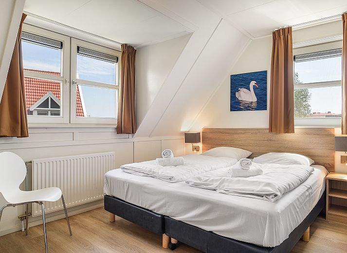 Floor plan of the Waterparc Veluwemeer 16-person villa in Biddinghuizen, Flevoland, featuring a spacious living room and modern kitchen.