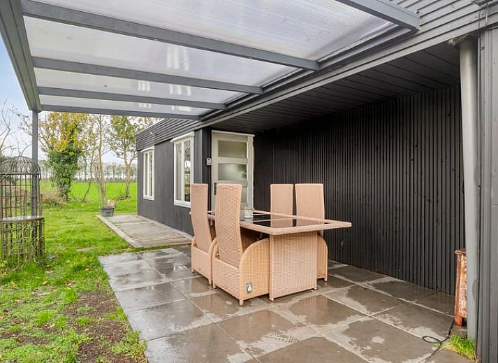 Terrace of Holiday home in Dronten with modern barbecue and green area in Eastern Flevoland, perfect place for outdoor dining.