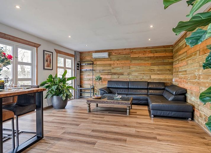 Terrace of Holiday home in Dronten with modern barbecue and green area in Eastern Flevoland, perfect place for outdoor dining.