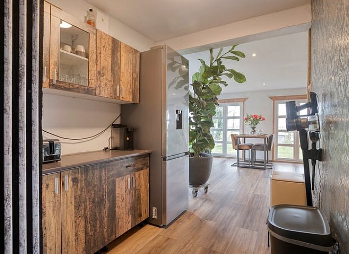 Cozy outdoor area of cottage in Dronten at dusk, with terrace and garden in Eastern Flevoland, ideal for evenings outside.