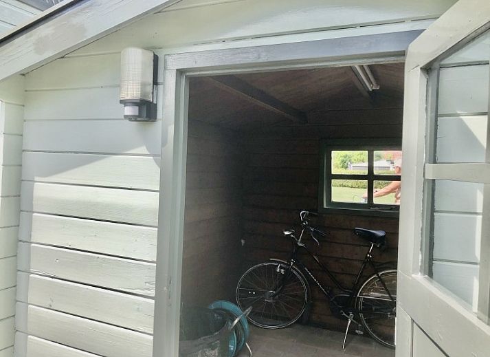 Terrace of A76 vacation home in Zeewolde, Southern Flevoland with comfortable sunbeds and seating area.