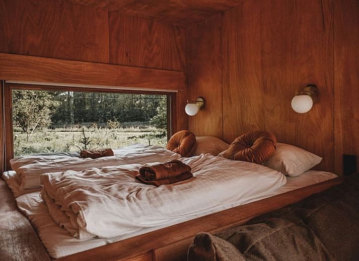 Vakantiehuis in Zeewolde, Zuidelijk Flevoland gelegen in een bosrijke omgeving met houten veranda.