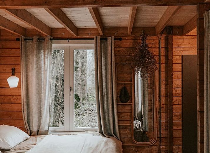 Cozy indoor area of Holiday Home in Zeewolde, Southern Flevoland, with wooden interior and comfortable seating area.