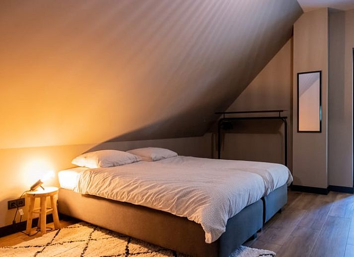 Cozy living room of Huisje in Appelscha, vacation home in the Frisian forests, overlooking the nature in Friesland.