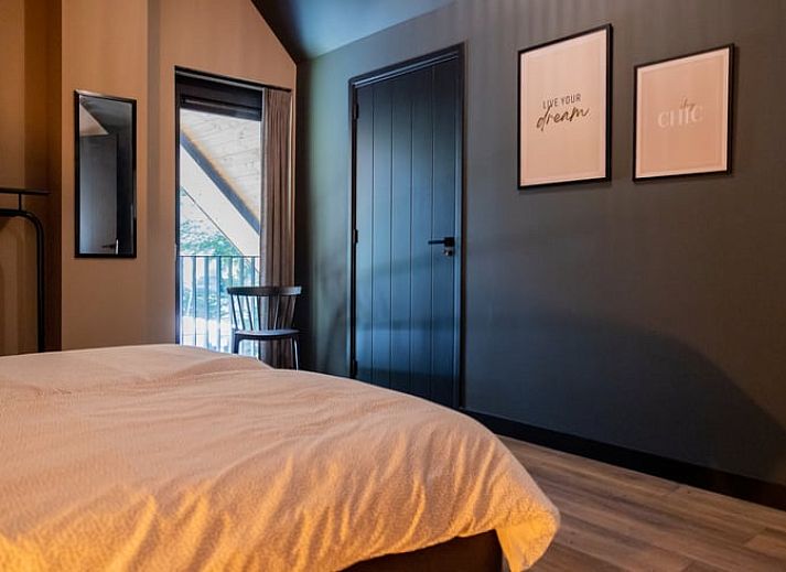 Cozy living room of Huisje in Appelscha, vacation home in the Frisian forests, overlooking the nature in Friesland.