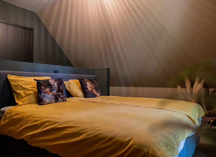 Cozy living room of Huisje in Appelscha, vacation home in the Frisian forests, overlooking the nature in Friesland.