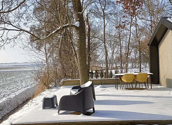 Enjoy the peace and quiet on the terrace of the vacation home in Oosterwolde, surrounded by the Frisian forests in Friesland.