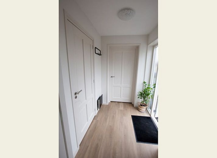 Gezellige binnenruimte van Vakantiehuis in Houtigehage, Friesland.