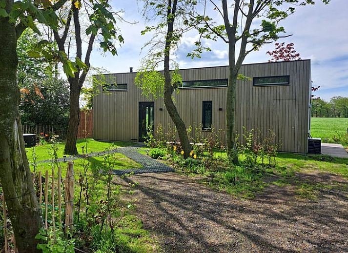 Vacation cottage in Lippenhuizen offers a beautiful view of the green Frisian forests in Friesland.
